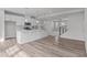 Open-concept kitchen flows into the living area, featuring a large island, stainless steel appliances, and modern finishes at 1329 Channing Park Cir, Cary, NC 27519