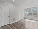 Sun-filled living room boasts recessed lighting and beautiful wood-look flooring at 1329 Channing Park Cir, Cary, NC 27519