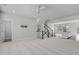 Open-concept space with modern finishes, stairs and an adjacent kitchen at 1329 Channing Park Cir, Cary, NC 27519