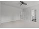 Spacious main bedroom showcasing an open doorway to a bathroom and walk-in closet, enhancing its appeal at 1329 Channing Park Cir, Cary, NC 27519