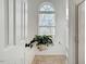 Bright bathroom with decorative window, green houseplant, and modern fixtures at 15 Rocky Point Ct, Fuquay Varina, NC 27526