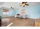 Bonus room with hardwood floors, bright walls, and ceiling fan at 15 Rocky Point Ct, Fuquay Varina, NC 27526