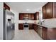 Modern kitchen with stainless steel appliances, granite countertops, and tiled backsplash at 15 Rocky Point Ct, Fuquay Varina, NC 27526