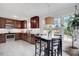 Bright kitchen with stainless steel appliances, wooden cabinets, and a cozy breakfast nook by the windows at 15 Rocky Point Ct, Fuquay Varina, NC 27526