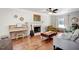 Comfortable living room features a fireplace, piano, and ample seating for relaxation and entertainment at 15 Rocky Point Ct, Fuquay Varina, NC 27526