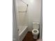 Bathroom featuring a tub with tiled walls and a toilet at 151 Schultz St # 151, Chapel Hill, NC 27514