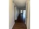 Hallway boasts sleek wood floors, leading to a bright living space with sliding glass doors at 151 Schultz St # 151, Chapel Hill, NC 27514