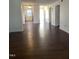 Expansive living area with wood flooring flowing seamlessly into an adjacent kitchen at 151 Schultz St # 151, Chapel Hill, NC 27514