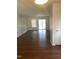 Bright and airy living room with gleaming wood floors and access to outdoor space through sliding doors at 151 Schultz St # 151, Chapel Hill, NC 27514