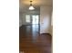 Spacious living room featuring sleek wood floors and large windows, creating a warm and inviting atmosphere at 151 Schultz St # 151, Chapel Hill, NC 27514