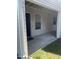 Covered patio with concrete flooring and view into home at 151 Schultz St # 151, Chapel Hill, NC 27514