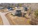 Aerial view of the backyard highlighting the home, shed, and surrounding neighborhood at 16 Eagle Swoop St, Zebulon, NC 27597