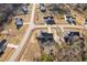 Aerial of a home showing a large lot, mature trees, and neighborhood at 16 Eagle Swoop St, Zebulon, NC 27597