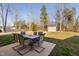 Outdoor seating, patio, and storage shed within a spacious backyard setting at 16 Eagle Swoop St, Zebulon, NC 27597