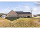 Exterior shot showing back of the house, patio seating, and grill at 16 Eagle Swoop St, Zebulon, NC 27597