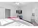 Well-lit bedroom featuring an overhead fan and a wall-mounted television at 16 Eagle Swoop St, Zebulon, NC 27597