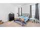 bedroom with a Paw Patrol themed bed, table, and dark dresser at 16 Eagle Swoop St, Zebulon, NC 27597