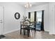 Cozy dining area with modern chandelier and natural light from sliding glass doors to patio at 16 Eagle Swoop St, Zebulon, NC 27597