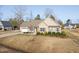 Inviting one-story home with well-kept lawn, attached garage, and pleasing landscaping at 16 Eagle Swoop St, Zebulon, NC 27597