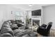 Comfortable living room with fireplace, large TV, and plush seating for relaxation at 16 Eagle Swoop St, Zebulon, NC 27597