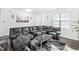 Spacious living room with modern decor, comfortable seating, and plenty of natural light at 16 Eagle Swoop St, Zebulon, NC 27597