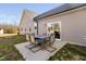 Back patio featuring an outdoor table and chairs, perfect for entertaining guests at 16 Eagle Swoop St, Zebulon, NC 27597
