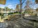 Wide shot of backyard deck showing a multi-level deck area and beautiful landscaping at 1708 Lakepark Dr, Raleigh, NC 27612