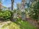 Garden view of a wooden walking path with lattice-style entrance at 1708 Lakepark Dr, Raleigh, NC 27612