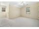 Comfortable bedroom featuring carpet flooring, two windows, and light walls at 1708 Lakepark Dr, Raleigh, NC 27612