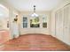 Cozy dining area with bay windows offering natural light and a view to the outdoors at 1708 Lakepark Dr, Raleigh, NC 27612