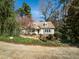 Charming Cape Cod home with dormer windows and a well-manicured lawn at 1708 Lakepark Dr, Raleigh, NC 27612