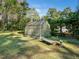 Exterior shot of a greenhouse with an adjacent bench at 1708 Lakepark Dr, Raleigh, NC 27612