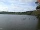 Scenic lake view with wooded shoreline, offering a peaceful and natural setting at 1708 Lakepark Dr, Raleigh, NC 27612