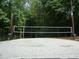 A volleyball court surrounded by trees at 1708 Lakepark Dr, Raleigh, NC 27612