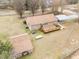 Expansive backyard with a wooden deck and additional outbuilding, perfect for outdoor activities at 1723 Bahama Rd, Bahama, NC 27503