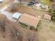 Overview of property with detached garage and outbuilding, showcasing the home's setting at 1723 Bahama Rd, Bahama, NC 27503