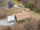 Sprawling property with main house, detached garage, outbuilding and a well-manicured lawn at 1723 Bahama Rd, Bahama, NC 27503