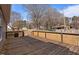 Spacious wooden deck with railing, ideal for outdoor entertaining with tree views at 1723 Bahama Rd, Bahama, NC 27503