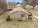 Rear view featuring a wooden deck, neutral siding, and neat landscaping around the home at 1723 Bahama Rd, Bahama, NC 27503