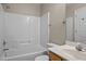 This bathroom has a tub with white surround, toilet, and marble countertop at 1723 Bahama Rd, Bahama, NC 27503