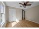 This bedroom has a large window, ceiling fan and closet at 1723 Bahama Rd, Bahama, NC 27503
