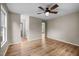 Bedroom with wood floors, ceiling fan, neutral paint and several windows at 1723 Bahama Rd, Bahama, NC 27503