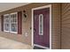 Inviting front entrance featuring a decorative door with sidelight and stylish exterior lighting at 1723 Bahama Rd, Bahama, NC 27503