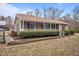 Attractive home with a welcoming front porch and well-maintained landscaping at 1723 Bahama Rd, Bahama, NC 27503