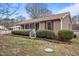 Charming home with a covered front porch, manicured landscaping, and attractive curb appeal at 1723 Bahama Rd, Bahama, NC 27503