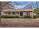 Charming single story home featuring a cozy front porch and well-maintained landscaping at 1723 Bahama Rd, Bahama, NC 27503
