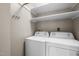 The laundry room includes a washer, dryer, and shelves at 1723 Bahama Rd, Bahama, NC 27503