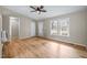 Bright living room with wood floors featuring a glass front door and several windows at 1723 Bahama Rd, Bahama, NC 27503
