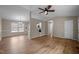 Bright living room featuring neutral paint, wood floors, chandelier, and ceiling fan at 1723 Bahama Rd, Bahama, NC 27503