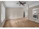 Bright living room featuring neutral paint, wood floors, and ceiling fan at 1723 Bahama Rd, Bahama, NC 27503